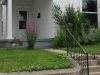 In Indiana--I don't know what the purple bush on the left is, but on the right are perennial phlox, Russian sage, and a rose of sharon that isn't blooming yet.